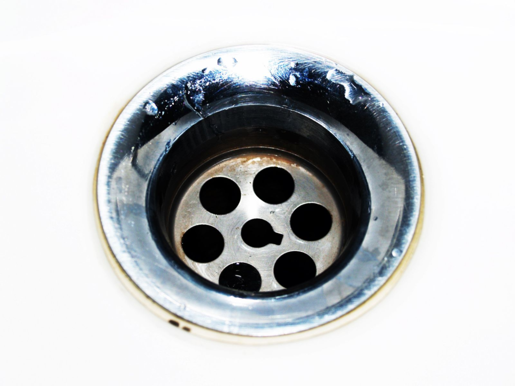 Chrome sink drain with water droplets